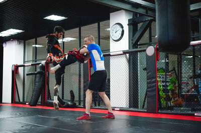 People practicing boxing in ring