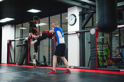 People practicing boxing in ring