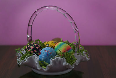 Close-up of easter eggs in basket on table