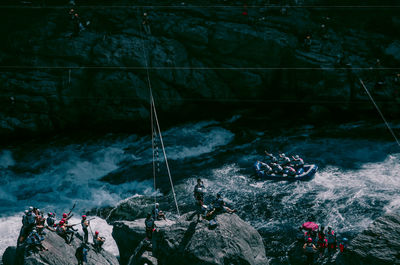 High angle view of people fishing in river