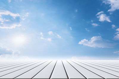 Low angle view of roof against cloudy sky