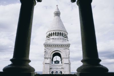 Low angle view of bell tower against sky