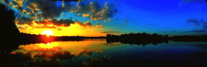 Scenic view of lake at sunset