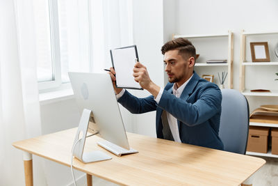 Man using laptop at table