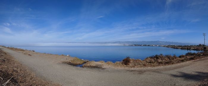 Scenic view of sea against blue sky