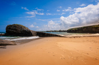 Scenic view of beach against sky