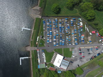 Directly above shot of kayaks moored at park by lakeshore