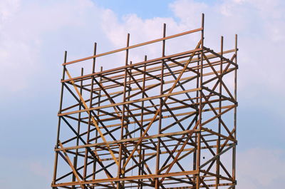 Low angle view of communications tower against sky