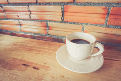 Coffee cup on wooden table