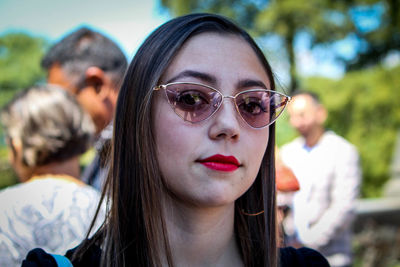 Portrait of beautiful young woman wearing sunglasses