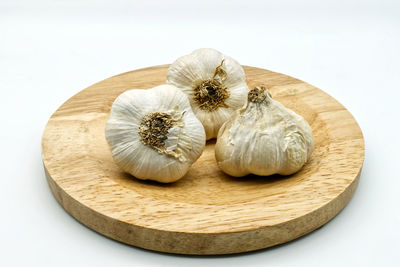 High angle view of candies on table against white background
