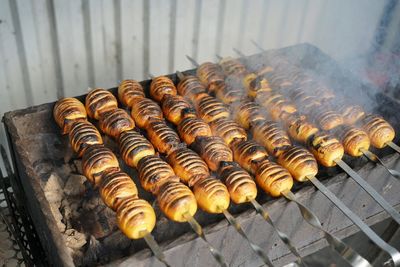 High angle view of meat on barbecue grill