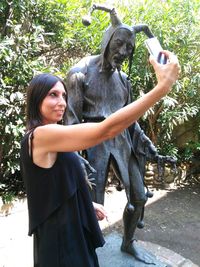 Portrait of beautiful woman holding mobile phone