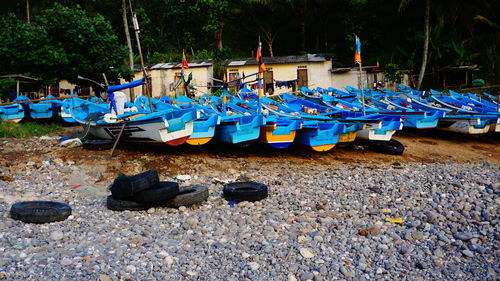 Boats moored on shore