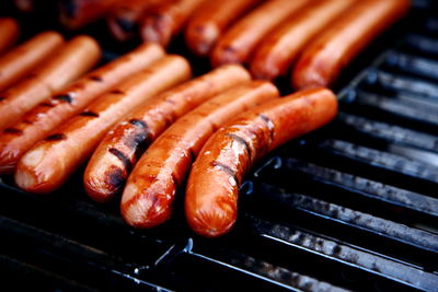 Close-up of sausages on barbecue grill