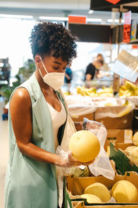 Midsection of woman holding ice cream