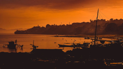 Silhouette of marina at sunset