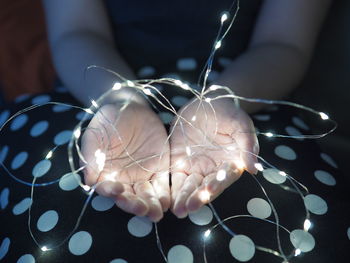 Close-up of hand holding umbrella