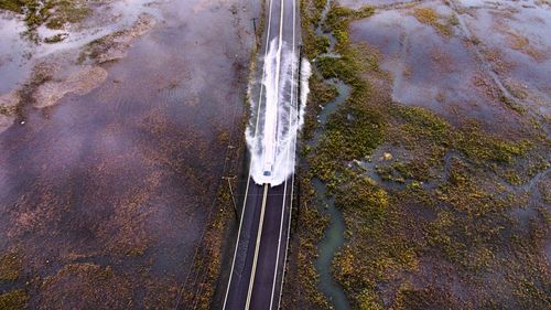 High angle view of water flowing through car