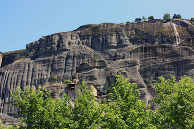 Low angle view of rock formations against sky