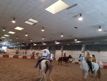 Group of people riding in shopping mall