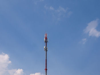 Low angle view of communications tower against sky