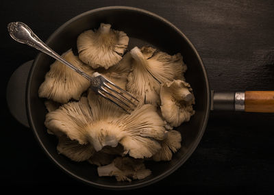 High angle view of mushrooms in bowl on table