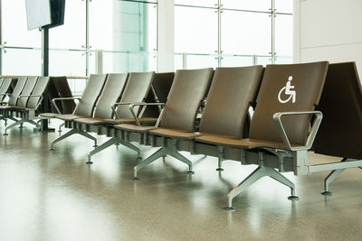 Empty chairs and tables in airport