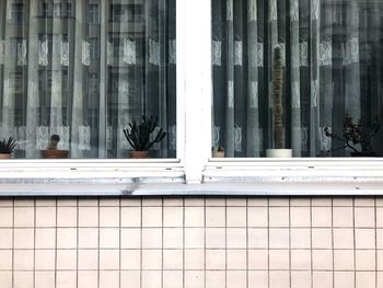 Reflection of building on glass window