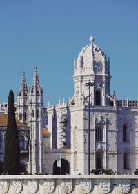 Low angle view of buildings against blue sky