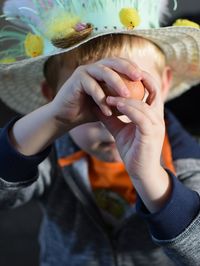 Close-up of boy playing with ball outdoors