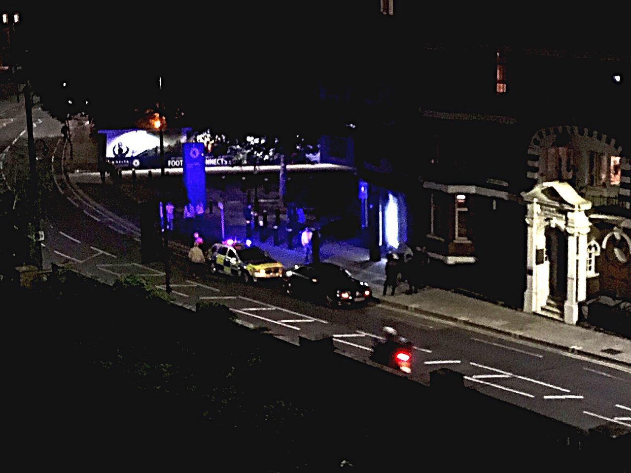 HIGH ANGLE VIEW OF CARS ON ROAD IN CITY