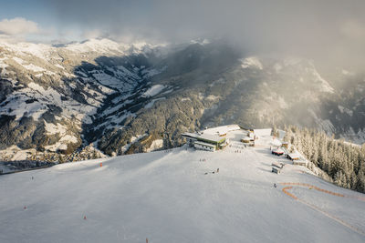 Skiers on empty slopes during covid-19 pandemic in the austrian alps.