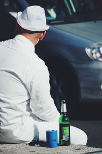 Rear view of man having food