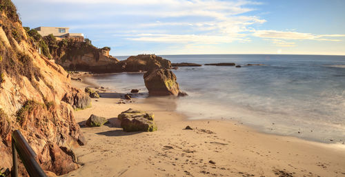 Rock keyhole and a long exposure of smooth water at pearl street beach in laguna beach, california