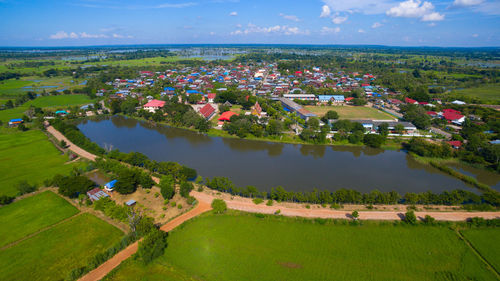 High angle view of trees and buildings against sky