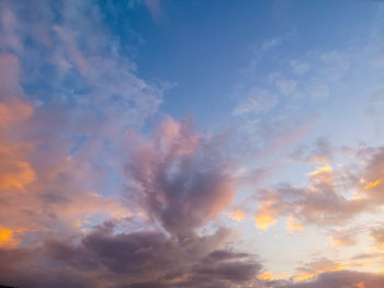 Low angle view of dramatic sky during sunset