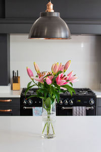 Flower vase on table at home