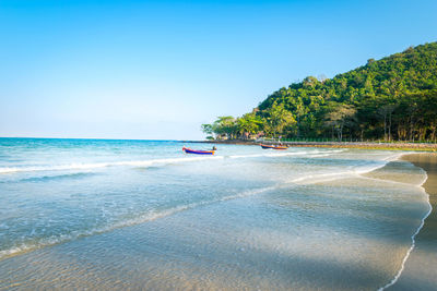 Scenic view of beach against clear sky