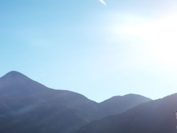 Scenic view of mountains against clear blue sky