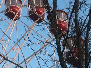 Low angle view of illuminated street light against sky