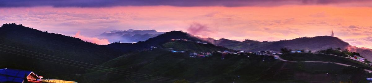 Panoramic view of mountains against sky at sunset