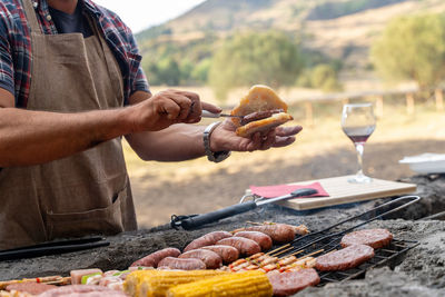 Midsection of man preparing food