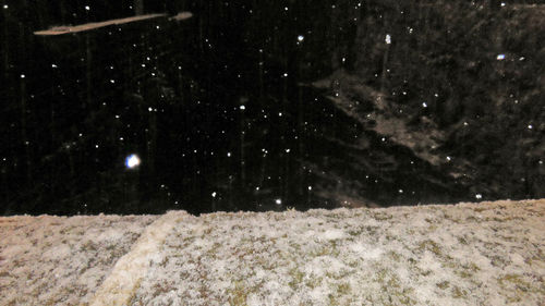 Snow on field at night