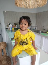 Happy boy standing at home