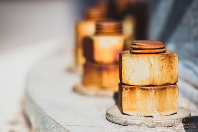 Close-up of rusty metal on table