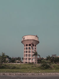 Low angle view of water tower against sky