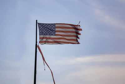 Low angle view of flag against sky