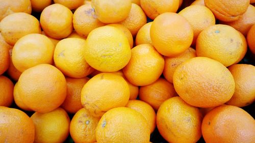 Full frame shot of oranges at market stall