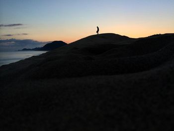 Silhouette people at sunset